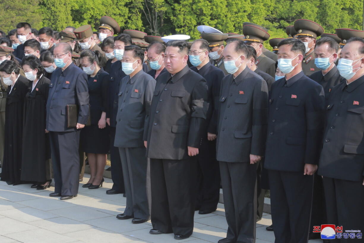 In this photo provided by the North Korean government, North Korean leader Kim Jong Un, center, attends a ceremony for Marshal of the Korean People's Army Hyon Chol Hae at a cemetery in Pyongyang, North Korea Sunday, May 22, 2022. Independent journalists were not given access to cover the event depicted in this image distributed by the North Korean government. The content of this image is as provided and cannot be independently verified. Korean language watermark on image as provided by source reads: "KCNA" which is the abbreviation for Korean Central News Agency.