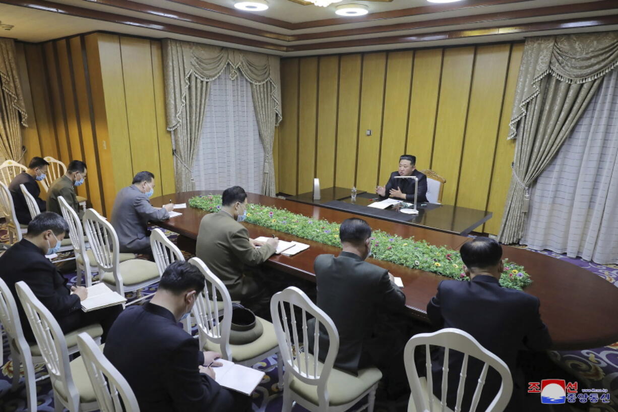 In this photo provided by the North Korean government, North Korean leader Kim Jong Un, top, visits state emergency epidemic prevention headquarters in North Korea Thursday, May 12, 2022. Independent journalists were not given access to cover the event depicted in this image distributed by the North Korean government. The content of this image is as provided and cannot be independently verified.   Korean language watermark on image as provided by source reads: "KCNA" which is the abbreviation for Korean Central News Agency.