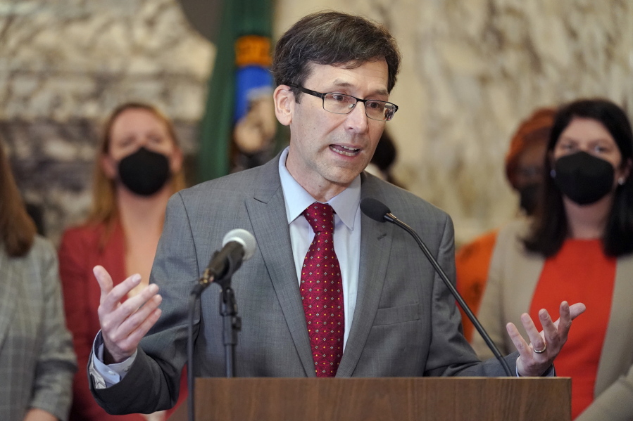 Washington Attorney General Bob Ferguson speaks March 23, 2022, at the Capitol in Olympia, Wash. Months into a complex trial over their role in flooding Washington with highly addictive painkillers, the nation's three largest opioid distributors have agreed to pay the state $518 million. Ferguson announced the deal Tuesday, May 3, 2022. (AP Photo/Ted S.