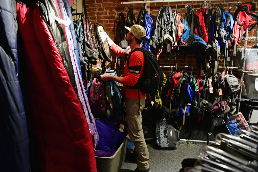 John Norvell shops for items in the consignment section of Wilderness Exchange Unlimited on June 1, 2022, in Denver. Novell came from Fraser to shop for consignment items at the store. (Helen H.