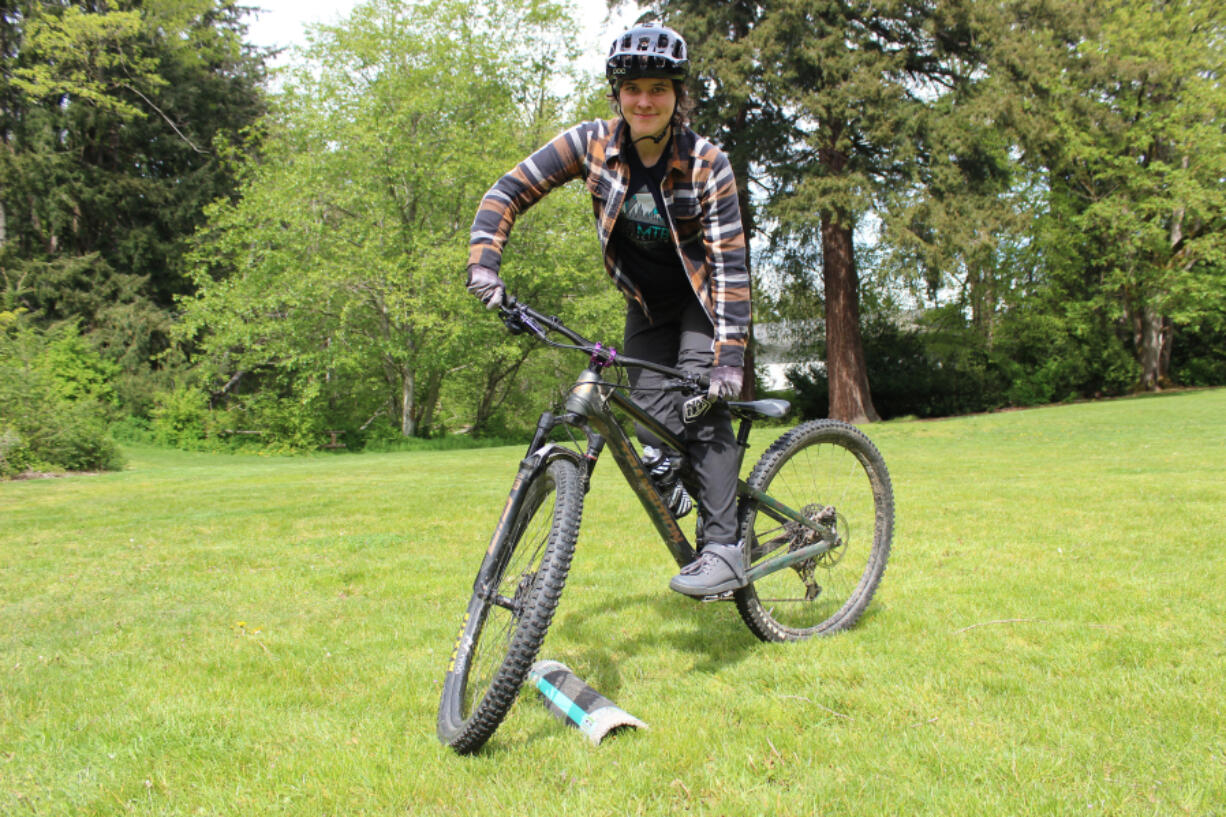 Emily Ford, a coach and instructor with Radical Roots MTB in Bellingham, Washington, demonstrates a practice technique for steering around trail obstacles.