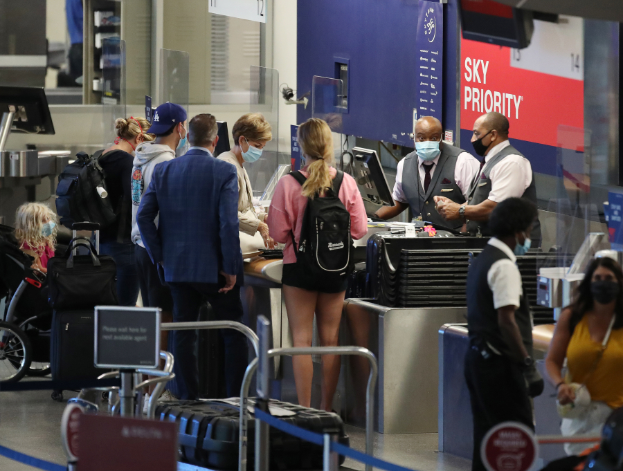 Travelers at the Delta Air Lines ticketing counter in August 2020 at Minneapolis-St. Paul International Airport in Bloomington, Minnesota.
