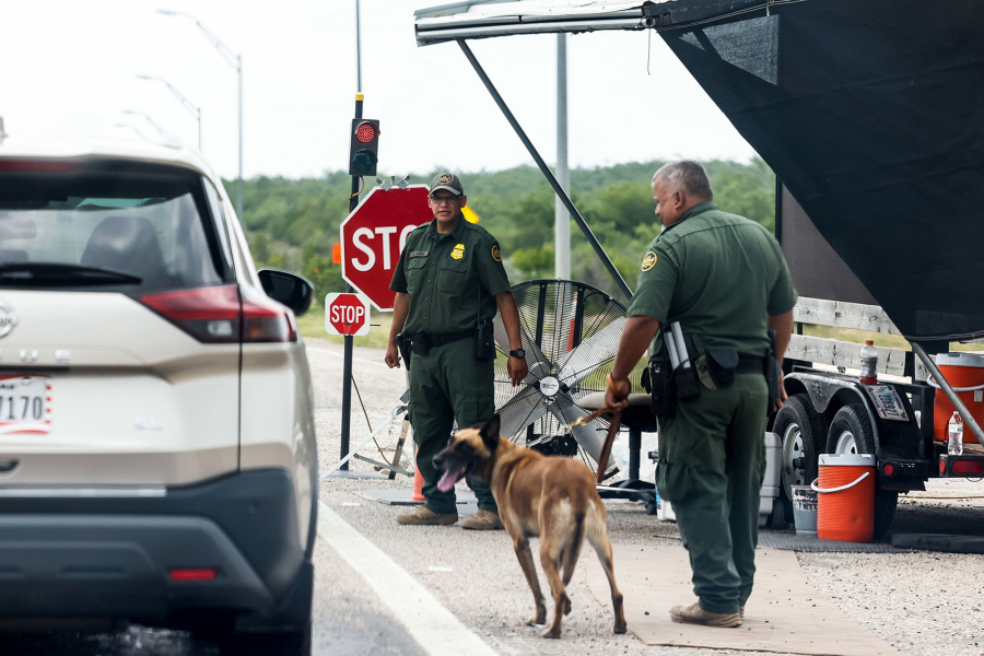 Border Patrol officers inspect a line of cars in on US-90 in Uvalde, Texas on Tuesday, May 31, 2022. A new U.S. Customs and Border Protection Inspection Station Check Point is currently under construction.