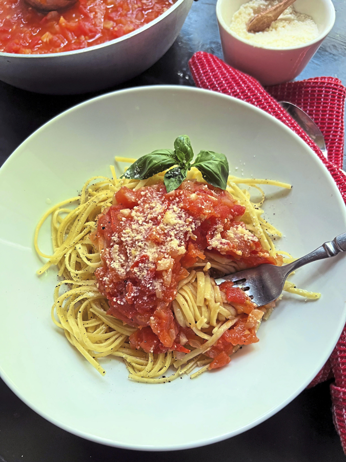 Black pepper linguini gets a easy summer sauce made with fresh tomatoes, onion and garlic.