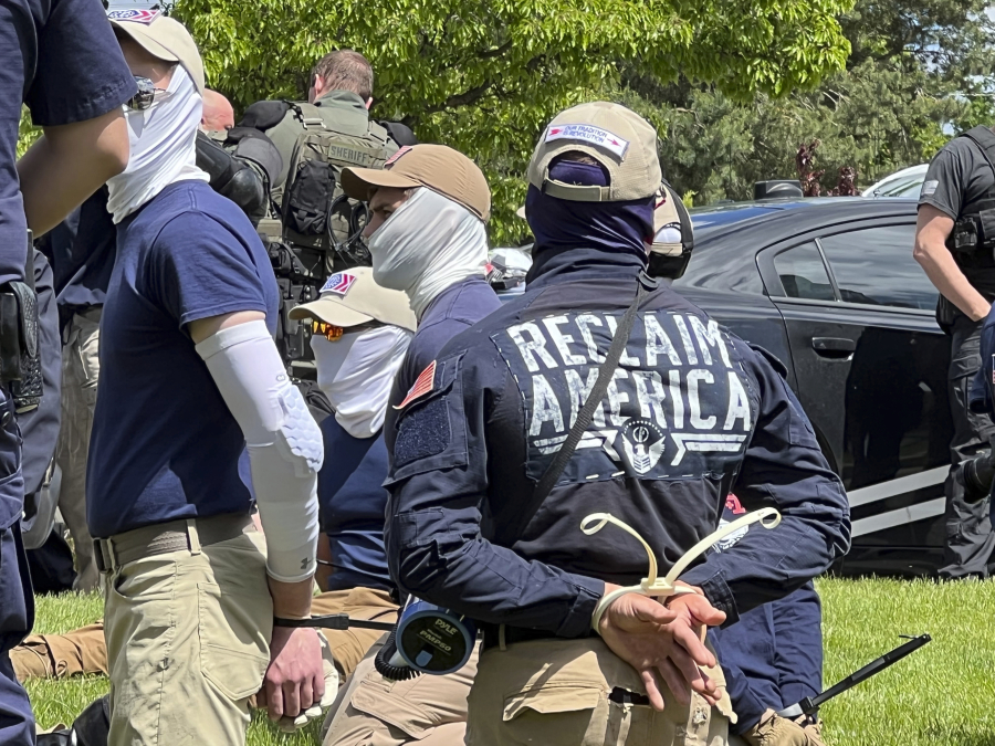 Authorities arrest members of the white supremacist group Patriot Front near an Idaho pride event in June 2022 in Couer d'Alene, Idaho.