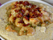 Shrimp and grits, topped with crispy bacon. (Hillary Levin/St.
