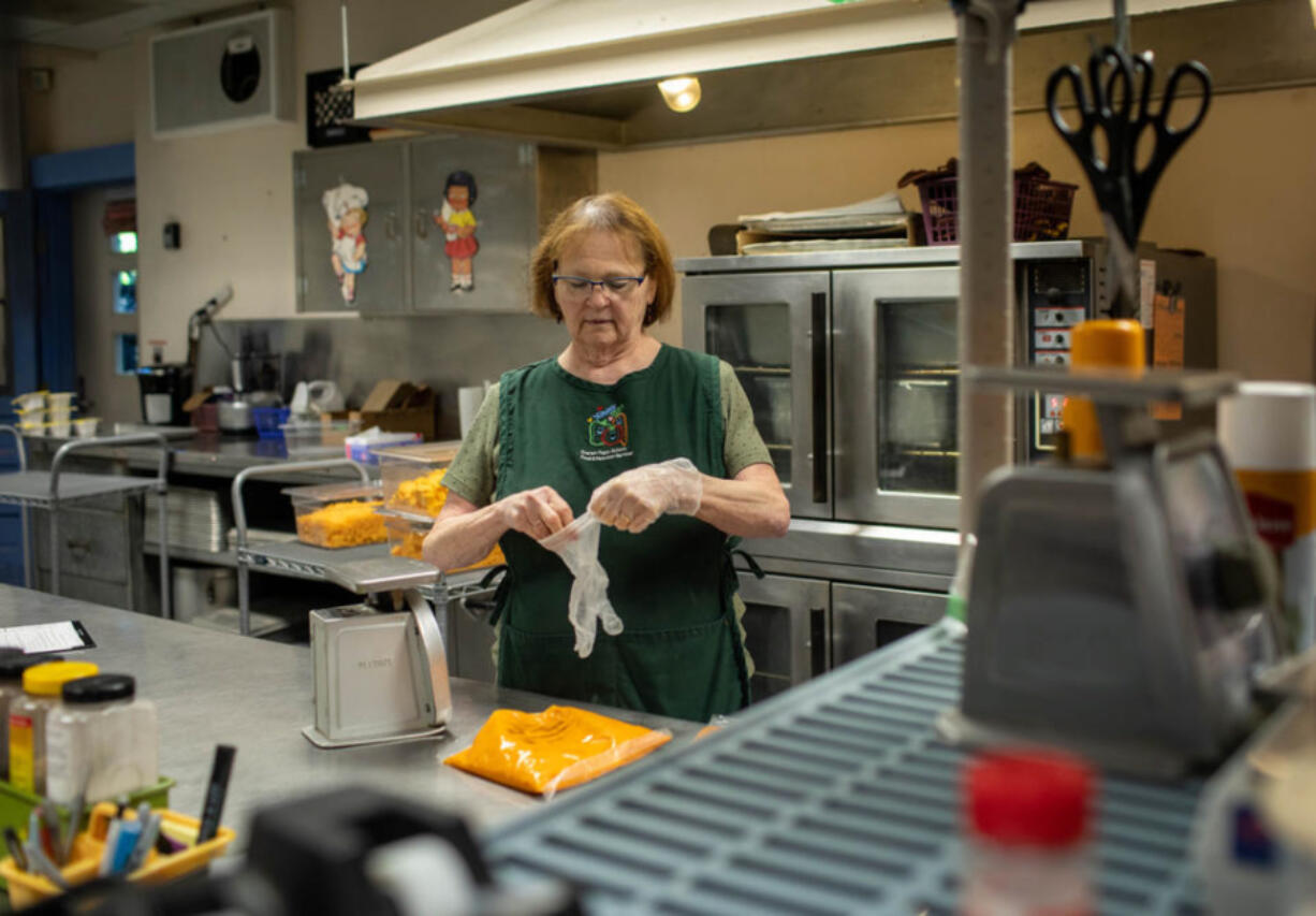 Cathy Rupe prepares meals for about 240 students each day at Jackson Elementary School in Everett, Washington.