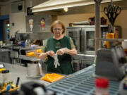 Cathy Rupe prepares meals for about 240 students each day at Jackson Elementary School in Everett, Washington.