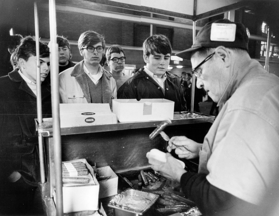 Hot dogs were popular at ball games and here, a hot dog vendor sells to fans at Wrigley Field during a game on April 14, 1970.