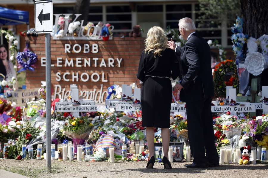 President Joe Biden and First Lady Jill Biden stand May 29 in front of the memorial outside Robb Elementary School to honor the victims killed in the school shooting in Uvalde, Texas.