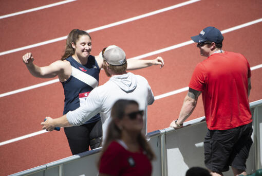 Kara Winger hugs her husband and coach Russ Winger after winning the women's javelin at the U.S. outdoor track and field championships on Saturday, June 25, 2022, in Eugene, Ore.