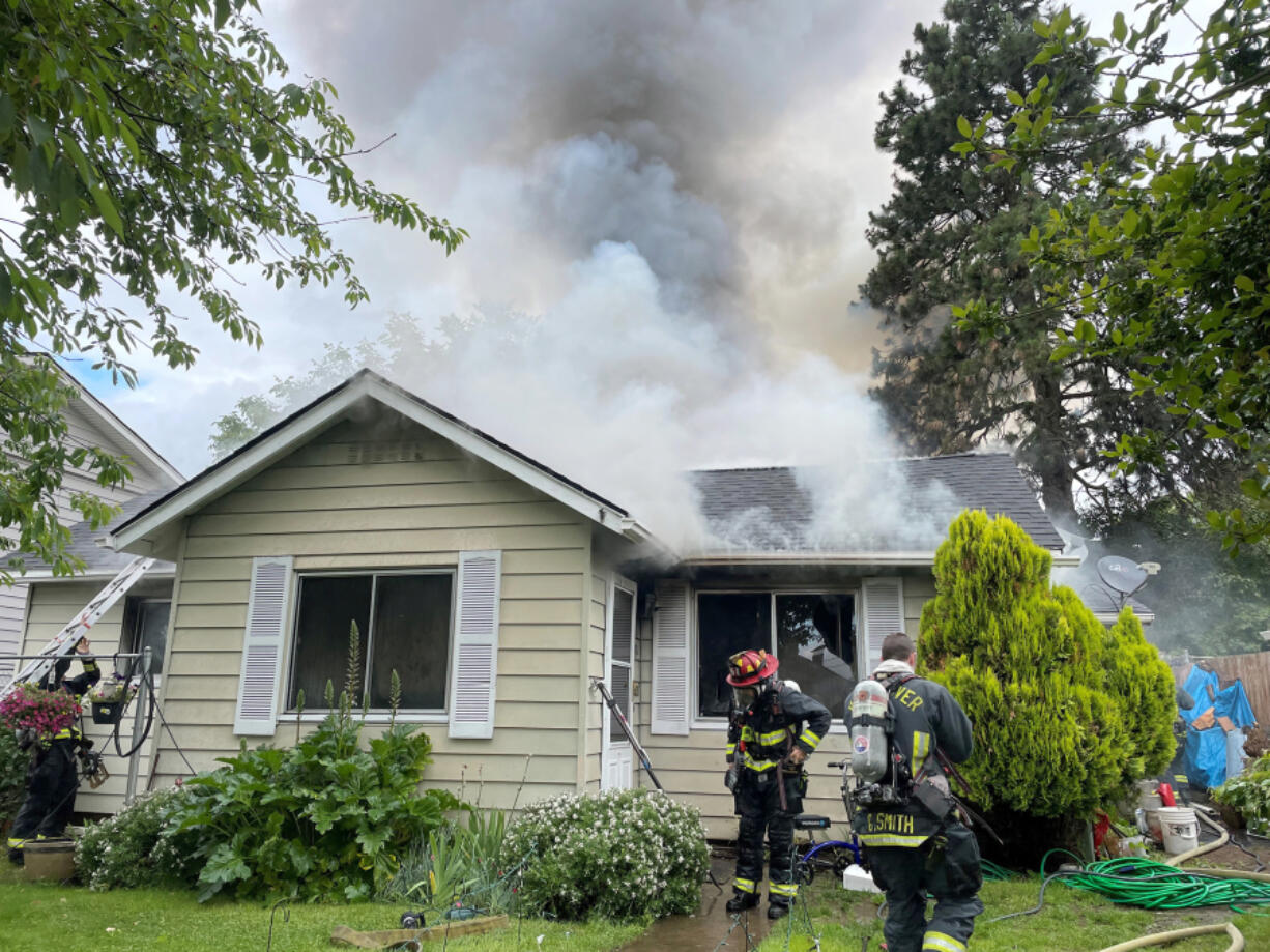 A house caught fire Thursday morning in Vancouver's Carter Park neighborhood. Seven people and four pets were displaced, the Vancouver Fire Department said.