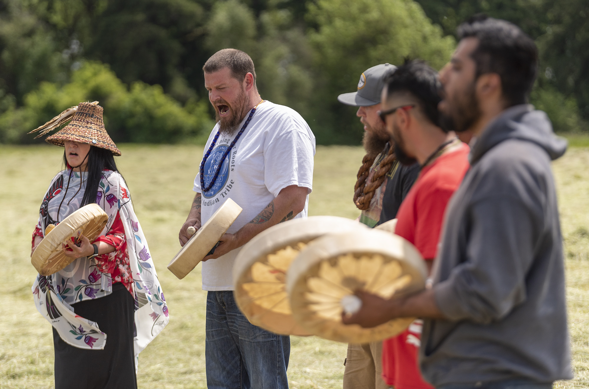 The Cowlitz Indian Tribe Drum Group performs a song Wednesday, June 1, 2022, before a groundbreaking ceremony at the future site of Clark CollegeÄôs Boschma Farms campus in Ridgefield.