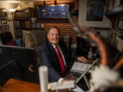 Ronald Carr sits at his desk at home in Vancouver where he composed "From One Rose," a theme song for the Portland Rose Festival performed by the Oregon Symphony May 26 as part of the Rose City Reunion Concert. Carr serves on the festival's board of directors.