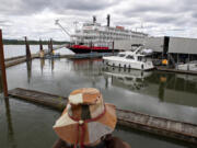 Washougal resident Sherian Wright takes in a sweeping view of the American Empress cruise ship near the Black Pearl on the Columbia on Wednesday.  The event celebrated the opening of the Port of Camas-Washougal Breakwater Access Project and the inaugural visit of the American Empress.