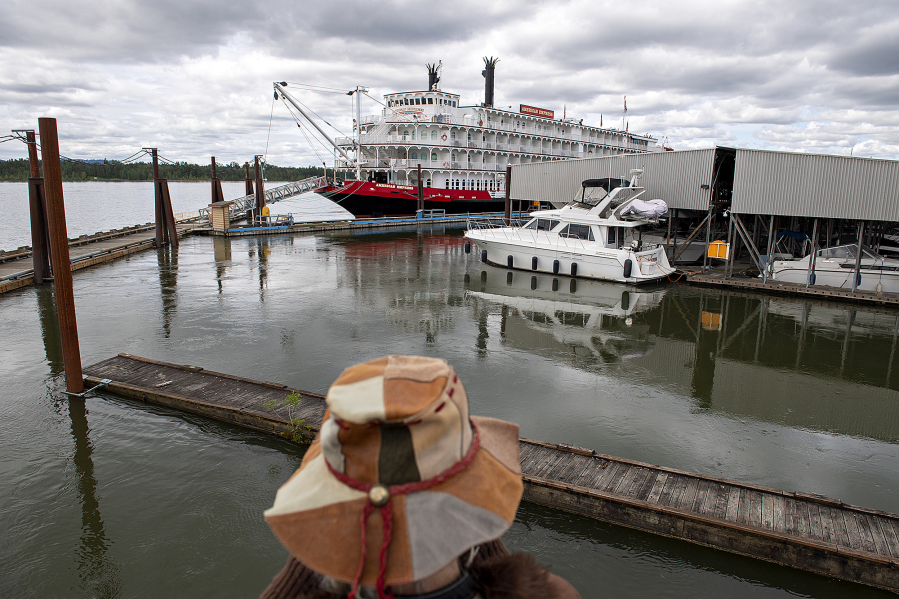 Washougal resident Sherian Wright takes in a sweeping view of the American Empress cruise ship near the Black Pearl on the Columbia on Wednesday.  The event celebrated the opening of the Port of Camas-Washougal Breakwater Access Project and the inaugural visit of the American Empress.