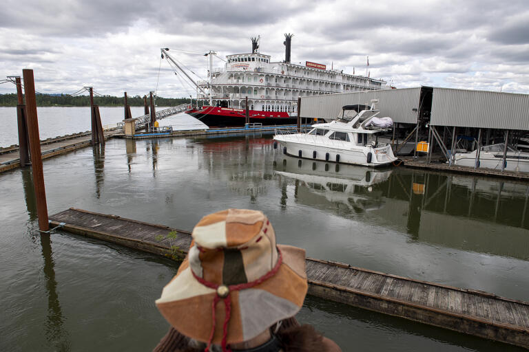Washougal resident Sherian Wright takes in a sweeping view of the American Empress cruise ship near the Black Pearl on the Columbia on Wednesday, June 8, 2022.  The event celebrated the opening of the Port of Camas-Washougal Breakwater Access Project and the inaugural visit of the American Empress.