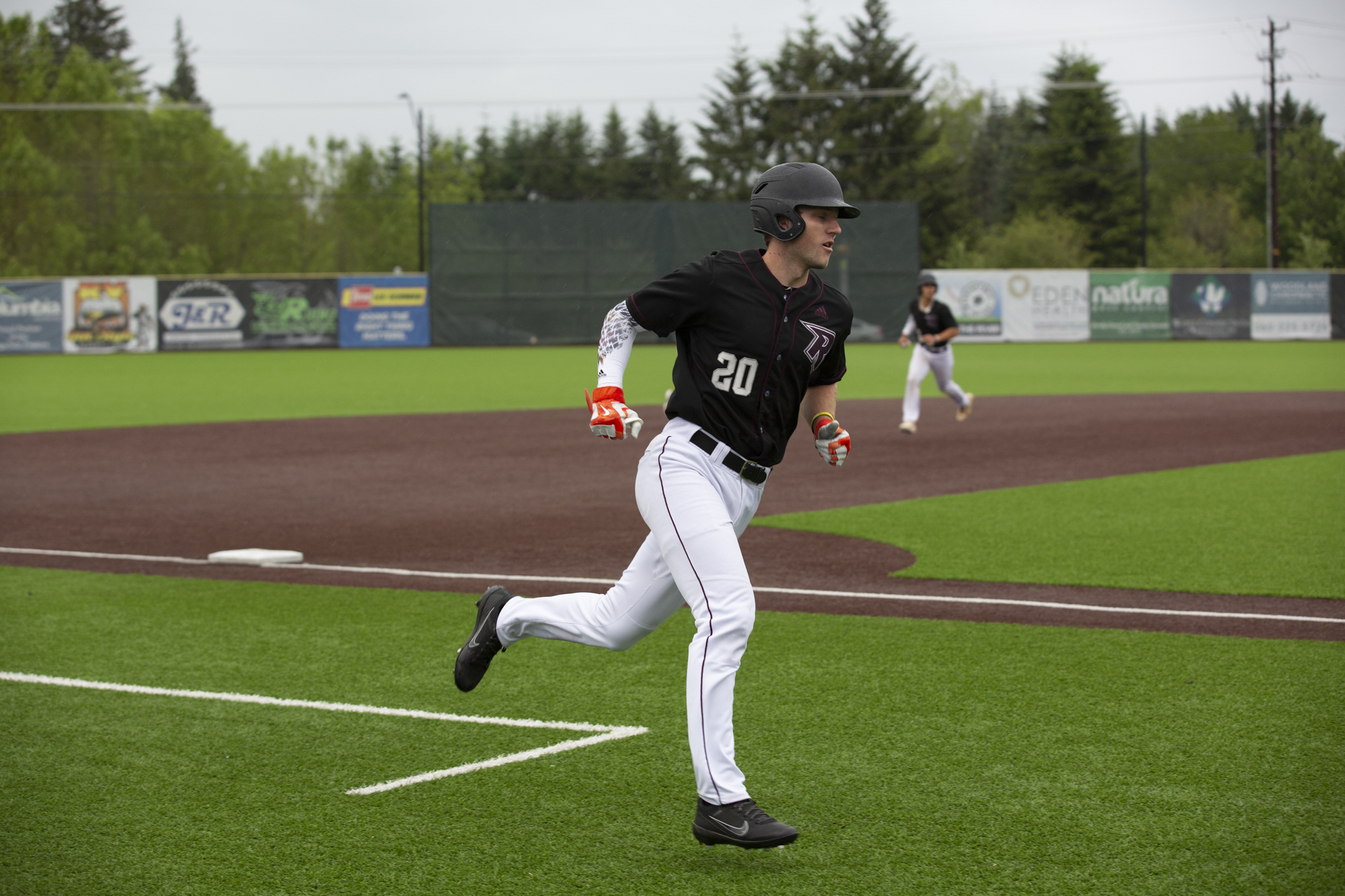 Mikey Kane of the Ridgefield Raptors rounds third base during their West Coast League season opener against the  Walla Walla Sweets at Ridgefield Outdoor Recreation Complex on Friday, June 3, 2022.