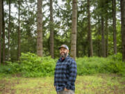 Gather and Feast Farm owner Mark Lopez stands on his property  in La Center. Farmers seeking to use their property to host weddings are facing an uncertain future. Lopez is standing in what he calls the "Cathedral of Trees" on his farm.