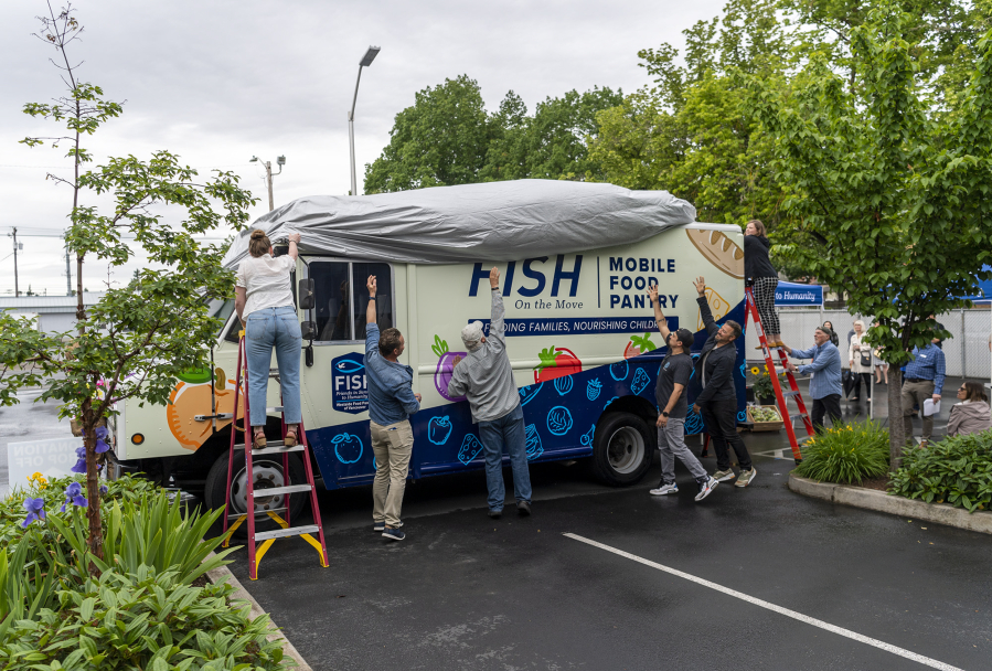 Donors who contributed to the FISH mobile food pantry unveil it for the first time. "We're embarking on a new adventure, and we're going to reach beyond the walls that we have here," Fish Executive Director James Fitzgerald said.
