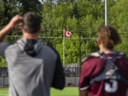 The Canadian flag waves during the Canadian national anthem Tuesday, June 14, 2022, during a Raptors game against the Edmonton Riverhawks at the Ridgefield Outdoor Recreation Complex.