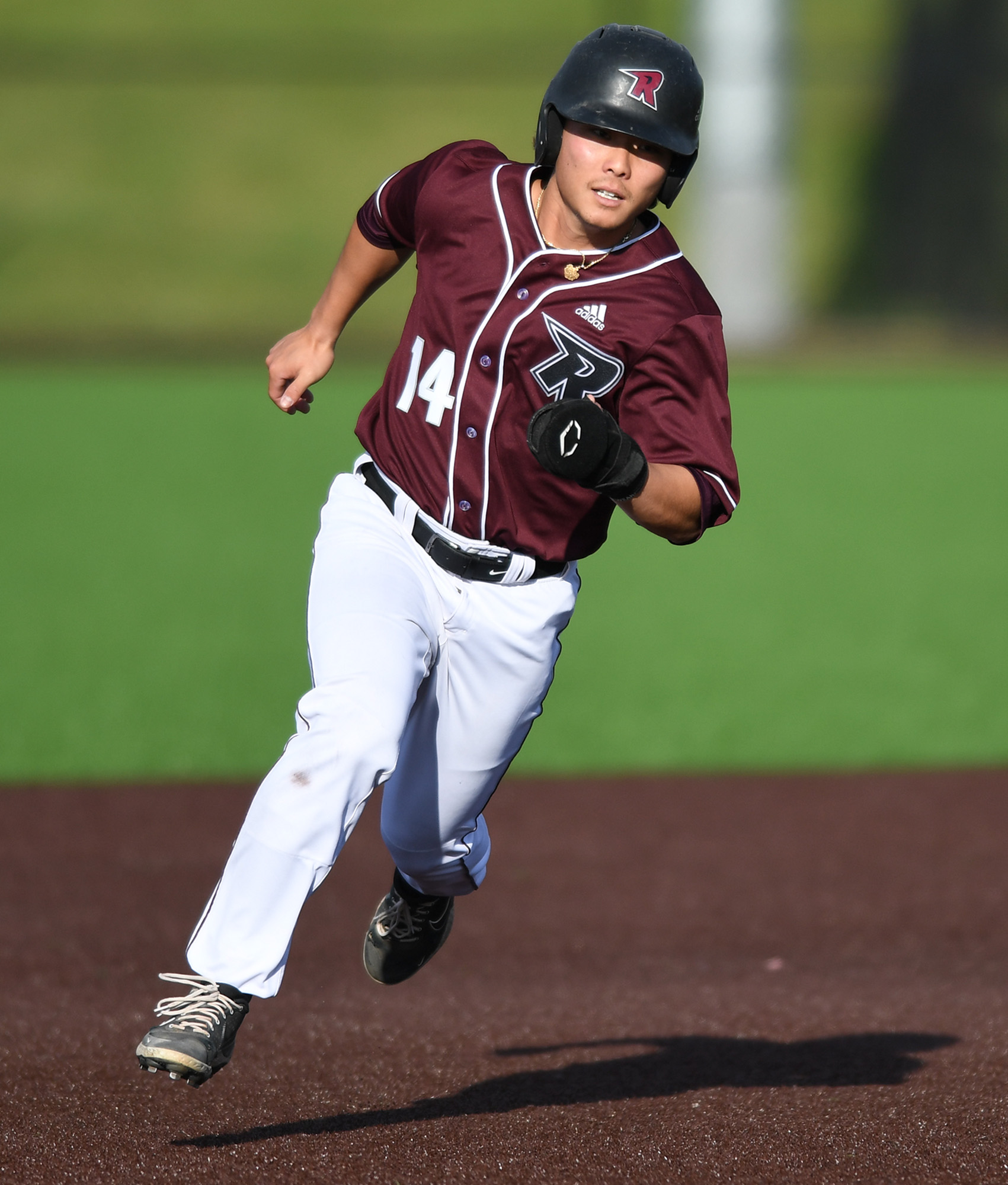 Raptors’ baserunner Jake Tsukada eyes third base Tuesday, June 14, 2022, during a Raptors game against the Edmonton Riverhawks at the Ridgefield Outdoor Recreation Complex.