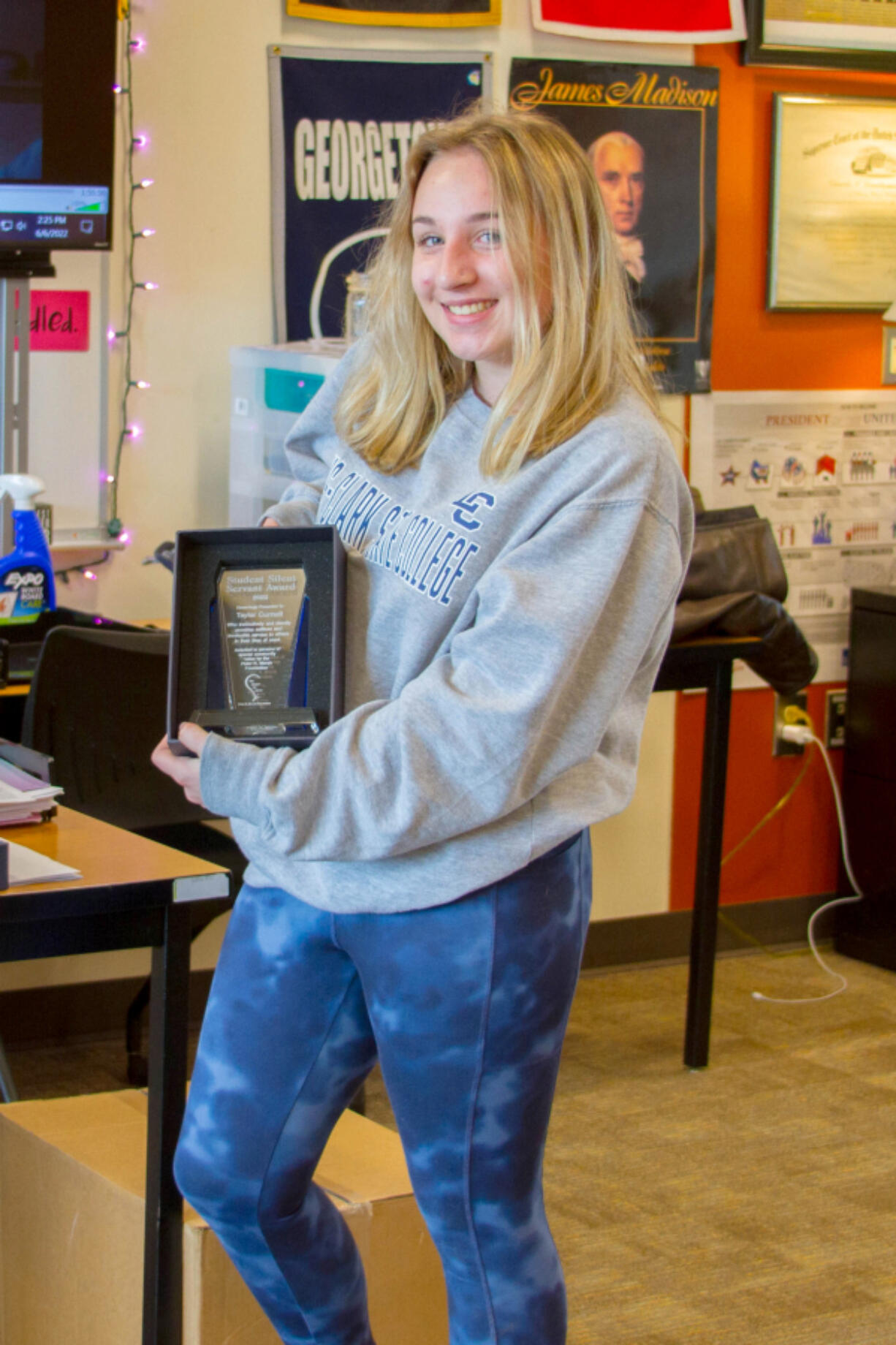 Woodland High School's Taylor Curnutt received the Silent Servant Student Award from the Peter R. Marsh Foundation which includes a special plaque along with a $500 grant for use toward Taylor's future plans.