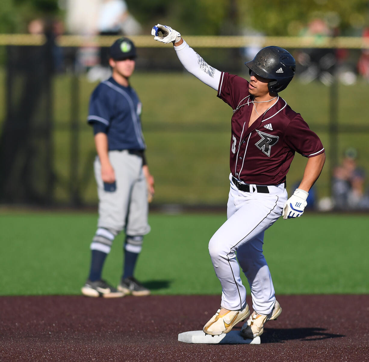 Raptors outfielder Jacob Sharp points as he rounds second base after a home run Tuesday, June 28, 2022, during a game between the Ridgefield Raptors and the Portland Pickles at the Ridgefield Outdoor Recreation Complex.
