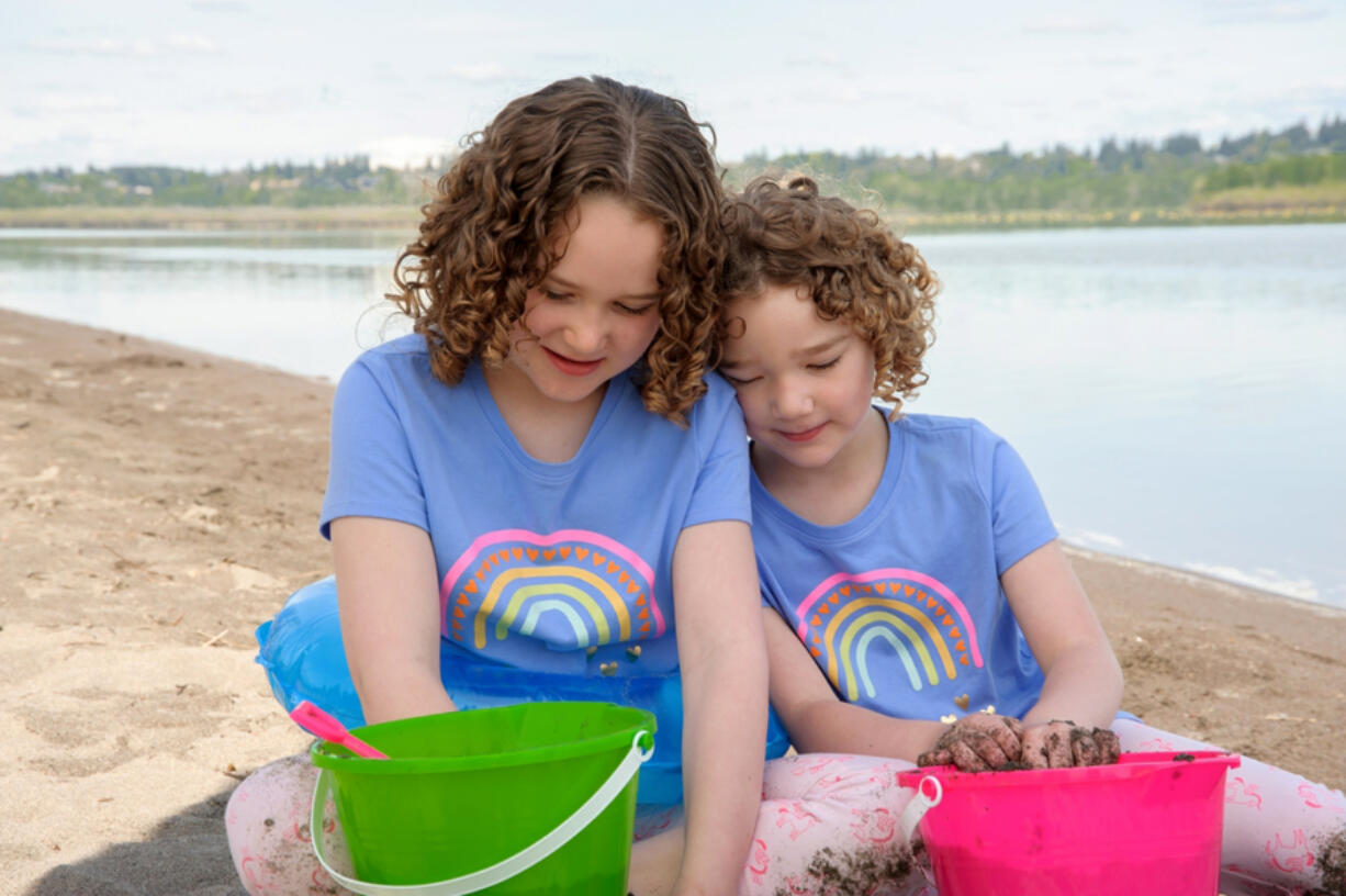 Bailey Wilkes, left, and her younger sister Sammy play in the sand at Vancouver Lake. At 6 months old, Bailey was diagnosed with severe allergies to more then 20 different kinds of food, including eggs and most kinds of nuts. Now, thanks to a unique program at the Southern California Food Allergy Institute and a grant provided by United Healthcare Children's Foundation, Bailey is on her way to overcoming many of her allergies.