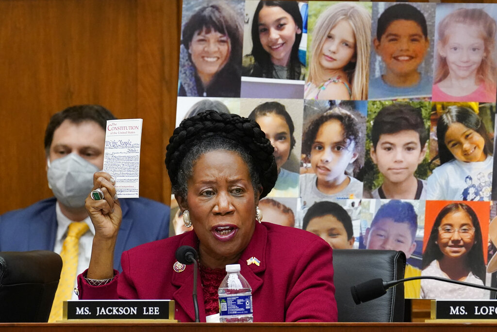 With photos of the young victims in Uvalde, Texas, behind her, Rep. Sheila Jackson Lee, D-Texas, speaks in support of Democratic gun control measures, called the Protecting Our Kids Act, in response to mass shootings in Texas and New York, at the Capitol in Washington, Thursday, June 2, 2022. (AP Photo/J.