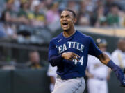 Seattle Mariners' Julio Rodriguez reacts after scoring a run against the Oakland Athletics during the sixth inning of a baseball game in Oakland, Calif., Tuesday, June 21, 2022.