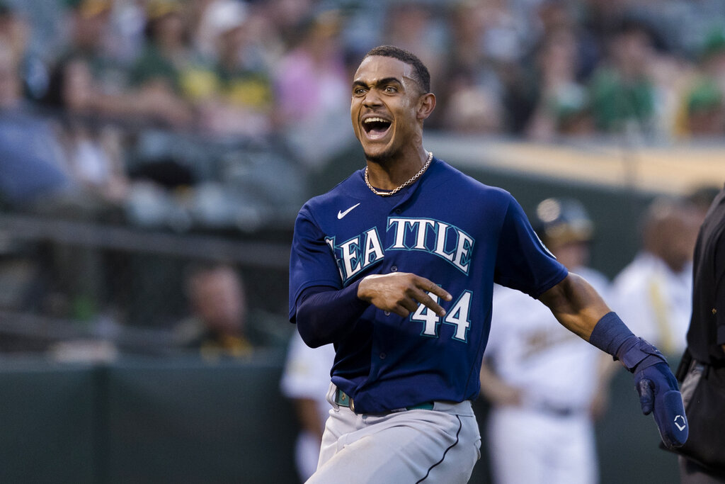Seattle Mariners' Julio Rodriguez reacts after scoring a run against the Oakland Athletics during the sixth inning of a baseball game in Oakland, Calif., Tuesday, June 21, 2022.
