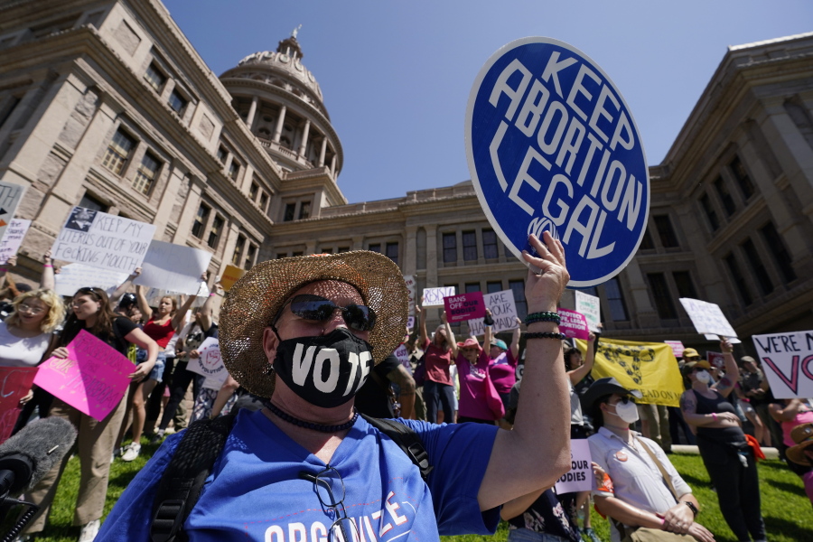 FILE-Abortion rights demonstrators attend a rally at the Texas Capitol, Saturday, May 14, 2022, in Austin, Texas. Progressive prosecutors around the U.S. are declaring they won't enforce some of the most restrictive and punitive anti-abortion laws that GOP-led states have waited years to implement. The promises come as the Supreme Court appears on track to overturn the constitutional right to abortion.