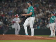 Seattle Mariners starting pitcher Robbie Ray stands on the mound after he gave up a single to Los Angeles Angels' Max Stassi that broke up his no-hitter during the seventh inning of a baseball game, Friday, June 17, 2022, in Seattle. (AP Photo/Ted S.