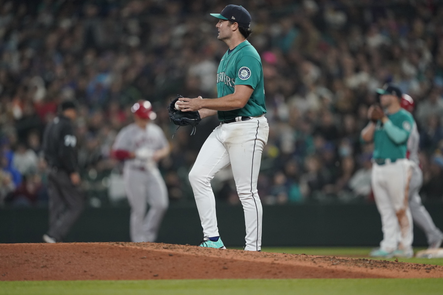 Seattle Mariners starting pitcher Robbie Ray stands on the mound after he gave up a single to Los Angeles Angels' Max Stassi that broke up his no-hitter during the seventh inning of a baseball game, Friday, June 17, 2022, in Seattle. (AP Photo/Ted S.