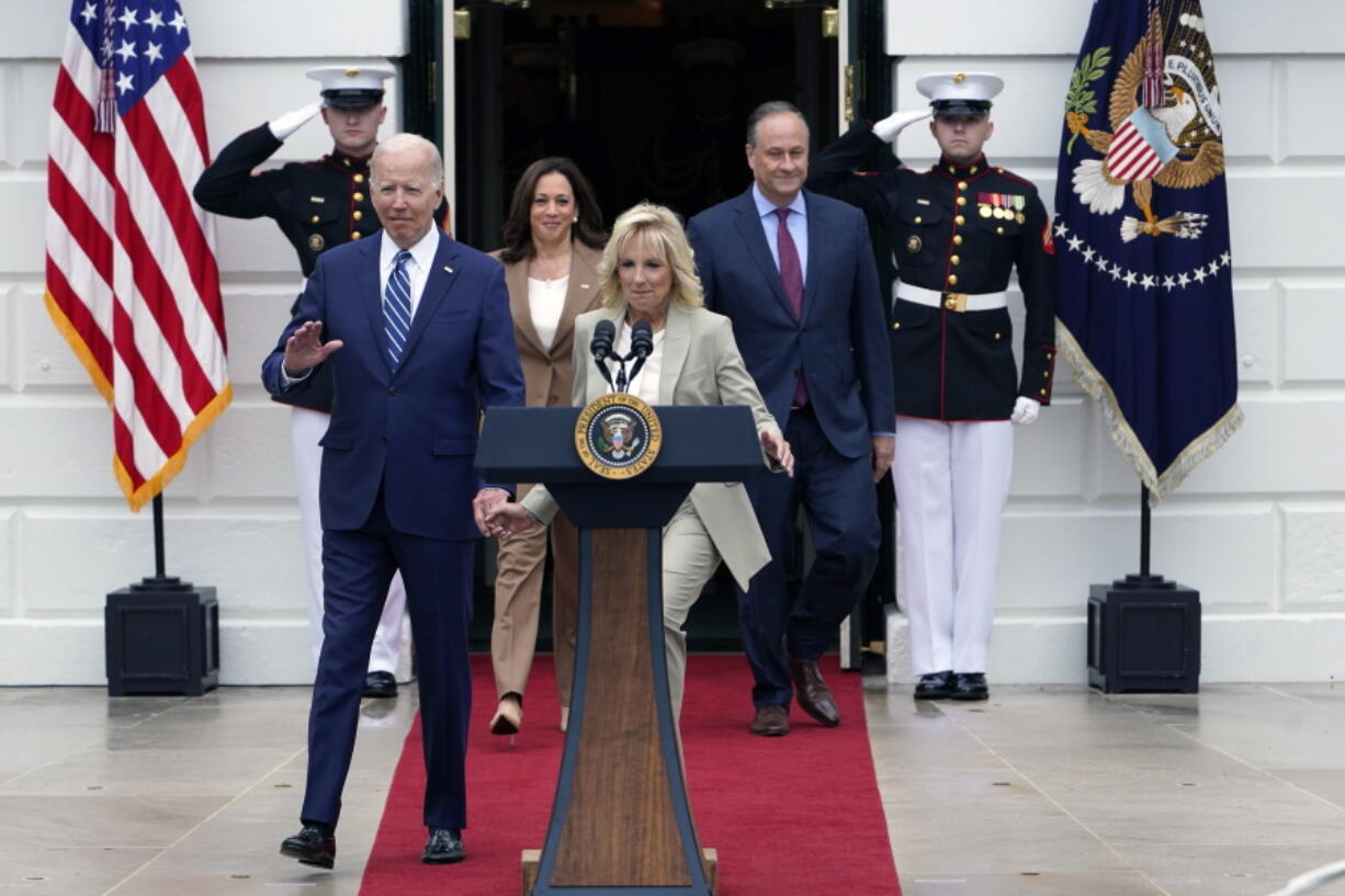 President Joe Biden, first lady Jill Biden, Vice President Kamala Harris, and her husband Doug Emhoff, walk out at the White House in Washington, Thursday, June 23, 2022, during an event to welcome wounded warriors, their caregivers and families to the White House as part of the annual Soldier Ride to recognize the service, sacrifice, and recovery journey for wounded, ill, and injured service members and veterans.