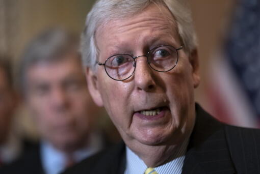 Senate Minority Leader Mitch McConnell, R-Ky., speaks with reporters following a closed-door caucus lunch, at the Capitol in Washington, Wednesday, June 22, 2022. (AP Photo/J.
