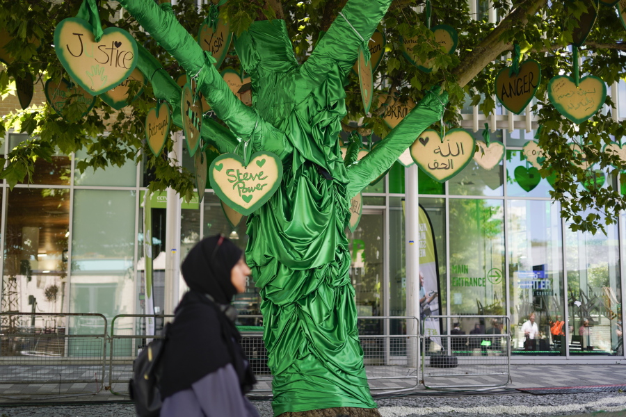 A tree is decorated, near to the remains of the Grenfell Tower, in London, Tuesday, June 14, 2022. Tuesday marks the fifth anniversary of the fire that killed 72 people.