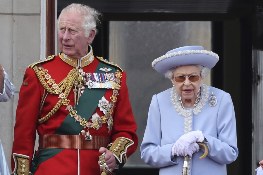 Britain's Prince Charles and Queen Elizabeth II, atch the Trooping of the Color in London, Thursday June 2, 2022, on the first of four days of celebrations to mark the Platinum Jubilee. The events over a long holiday weekend in the U.K. are meant to celebrate the monarch's 70 years of service.