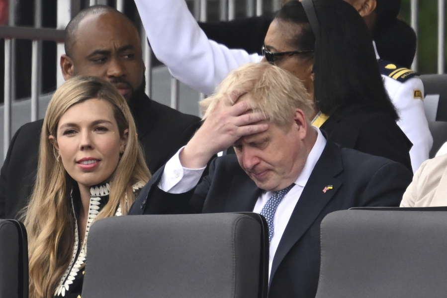 FILE - Britain's Prime Minister Boris Johnson and his wife Carrie, are seated during the Platinum Jubilee Pageant, in London, Sunday June 5, 2022, on the last of four days of celebrations to mark the Platinum Jubilee. Britain's governing Conservatives will hold a no-confidence vote in Prime Minister Boris Johnson on Monday, June 6, 2022 that could oust him as Britain's leader.