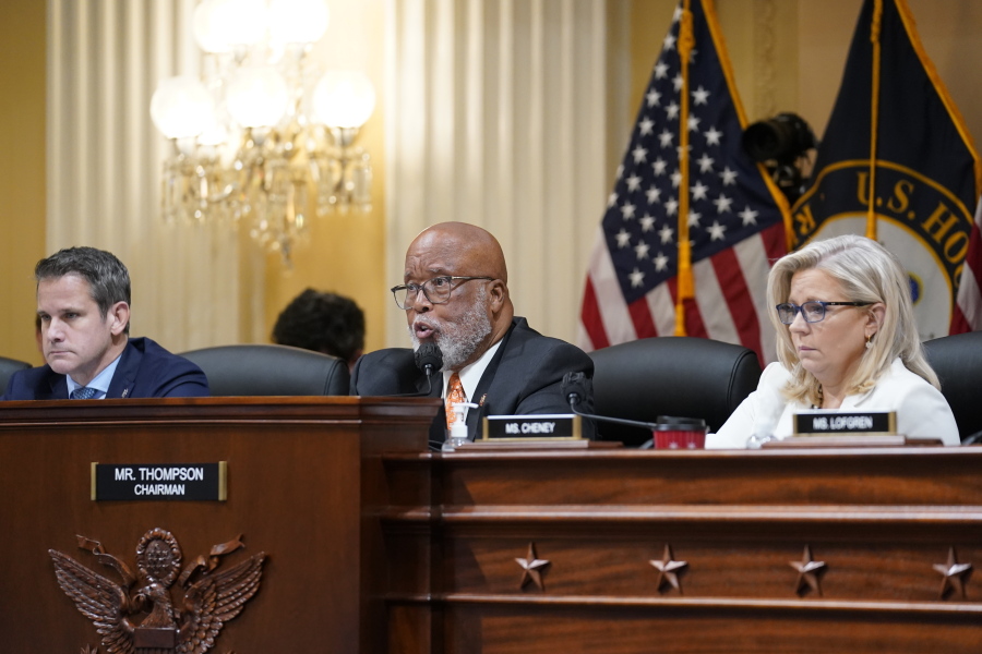 Chairman Bennie Thompson, D-Miss., center, speaks as the House select committee investigating the Jan. 6 attack on the U.S. Capitol continues to reveal its findings of a year-long investigation, at the Capitol in Washington, Thursday, June 23, 2022. Rep. Adam Kinzinger, R-Ill., left, and Vice Chair Liz Cheney, R-Wyo., right, listen. (AP Photo/J.