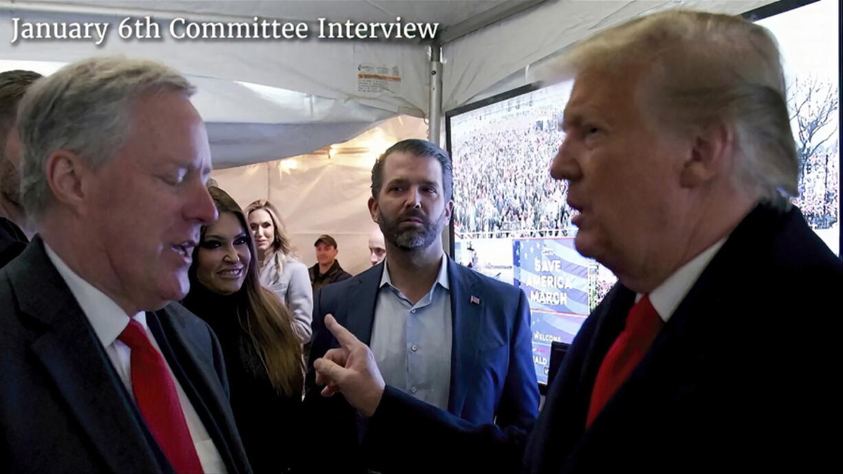 This exhibit from video released by the House Select Committee, shows a photo of former President Donald Trump talking to his chief of staff Mark Meadows before Trump spoke at the rally on the Ellipse on Jan 6, displayed at a hearing by the House select committee investigating the Jan. 6 attack on the U.S. Capitol, Tuesday, June 28, 2022, on Capitol Hill in Washington.