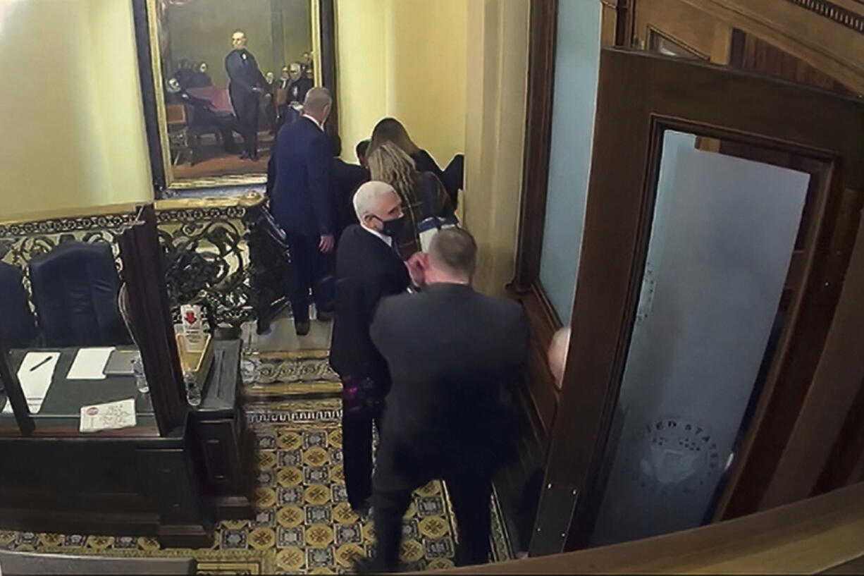 In this image from video, a security video shows Vice President Mike Pence being evacuated from near the Senate chamber as rioters breach the Capitol, on Jan. 6, 2021, at the Capitol in Washington. Pence won't be testifying at Thursday's Jan. 6 committee hearing. But he will be in the spotlight as the group turns its focus to former President Donald Trump's desperate attempts to persuade Pence to overturn the results of the 2020 presidential election.