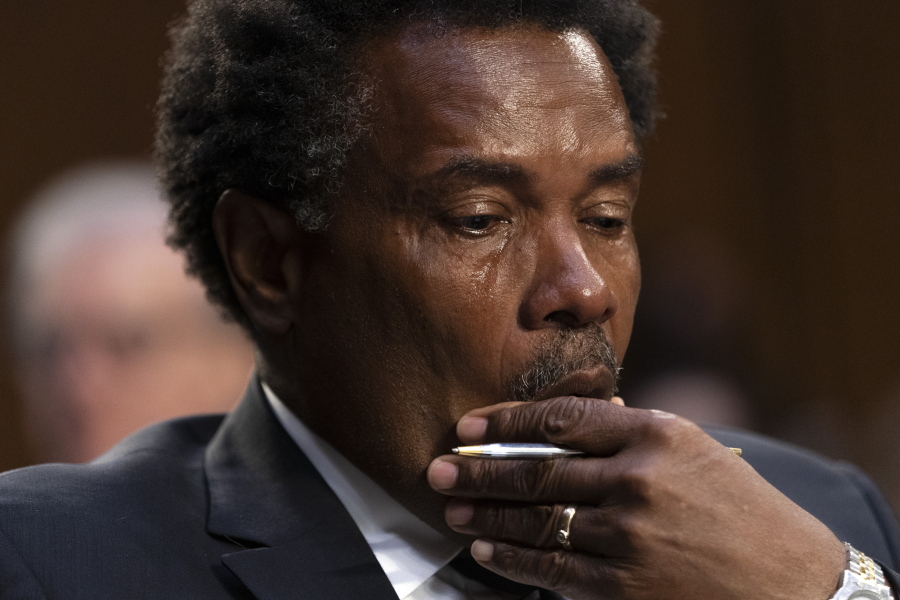 Garnell Whitfield, Jr., of Buffalo, N.Y., whose mother, Ruth Whitfield, was killed in the Buffalo Tops supermarket mass shooting, wipes away tears as he testifies at a Senate Judiciary Committee hearing on domestic terrorism, Tuesday, June 7, 2022, on Capitol Hill in Washington.