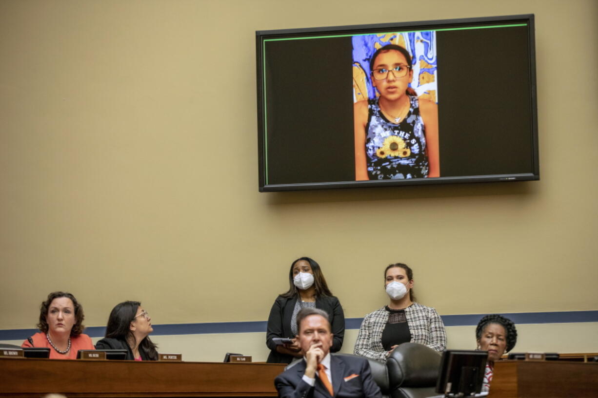 Miah Cerrillo, a fourth grade student at Robb Elementary School in Uvalde, Texas, and survivor of the mass shooting appears on a screen during a House Committee on Oversight and Reform hearing on gun violence on Capitol Hill in Washington, Wednesday, June 8, 2022.