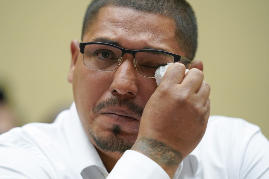Miguel Cerrillo, father of Miah Cerrillo a fourth grade student at Robb Elementary School in Uvalde, Texas, wipes his eye as he testifies during a House Committee on Oversight and Reform hearing on gun violence on Capitol Hill in Washington, Wednesday, June 8, 2022.