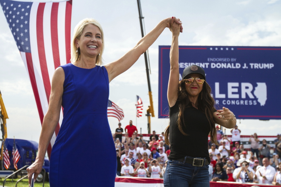 Rep. Mary Miller, R-Ill., left, is joined by Rep. Lauren Boebert, R-Colo., on stage at a rally at the Adams County Fairgrounds in Mendon, Ill., Saturday, June 25, 2022.