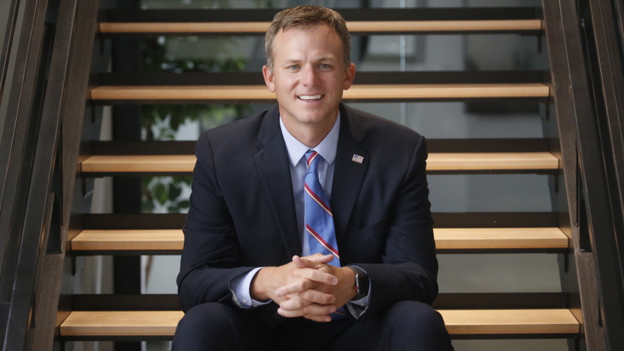 FILE - Utah's 1st Congressional District Republican candidate Blake Moore poses for photographs on Aug. 10, 2020, in Salt Lake City.