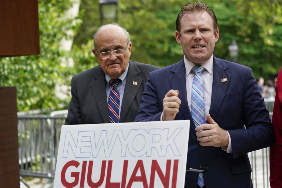 FILE - Andrew Giuliani, right, a Republican candidate for Governor of New York, is joined by his father, former New York City mayor Rudy Giuliani, during a news conference, June 7, 2022, in New York. One place the former New York City mayor is in high demand these days is on the campaign of his son, Andrew Giuliani, who on Tuesday is hoping to become the Republican nominee for governor of New York.
