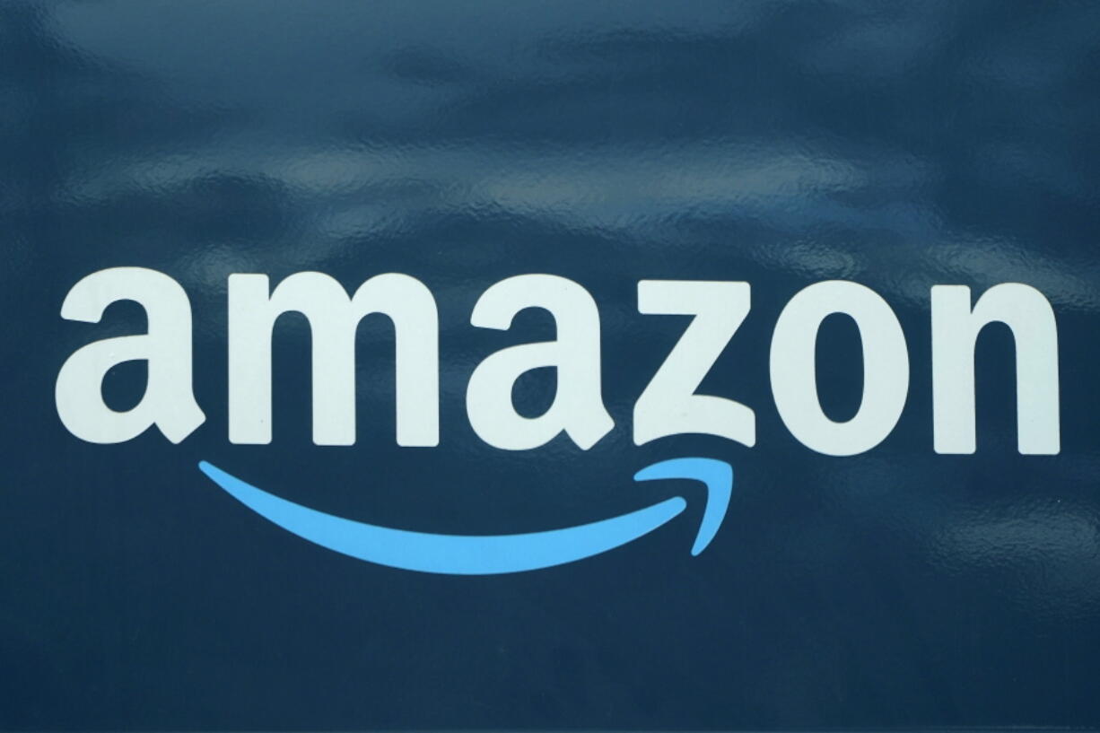 FILE - An Amazon logo appears on a delivery van, Oct. 1, 2020, in Boston. Amazon is limiting how many emergency contraceptives consumers can buy, joining other retailers who put in place similar caps following the Supreme Court decision overruling Roe v. Wade. Amazon's limit, which temporarily caps purchase of the contraceptives at three units per week, went into effect on Monday, June 27, 2022, a spokesperson for the e-commerce giant confirmed to the Associated Press.